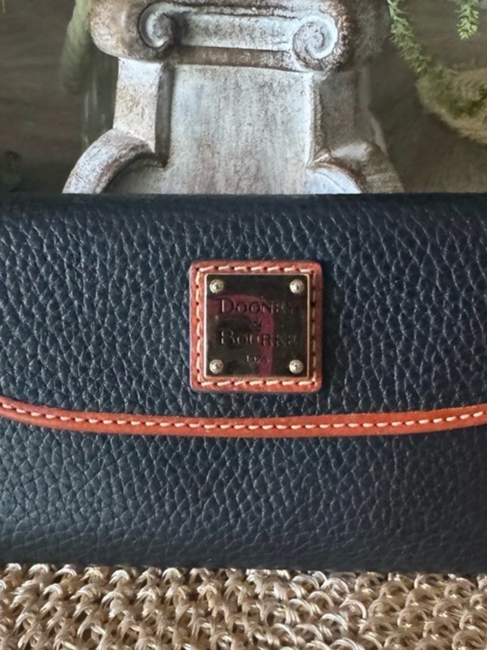 Dooney & Bourke Black Wallet with Brown Trim and Logo Plaque